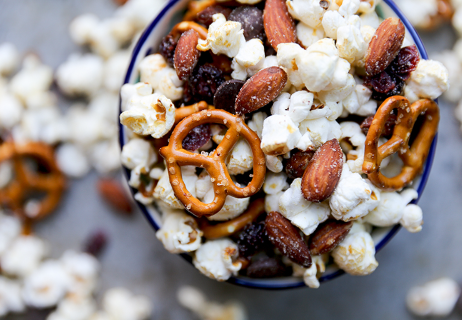Popcorn mixed with smoked almonds, raisins, and pretzels