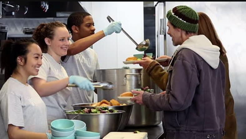 Teenagers volunteering at a soup kitchen