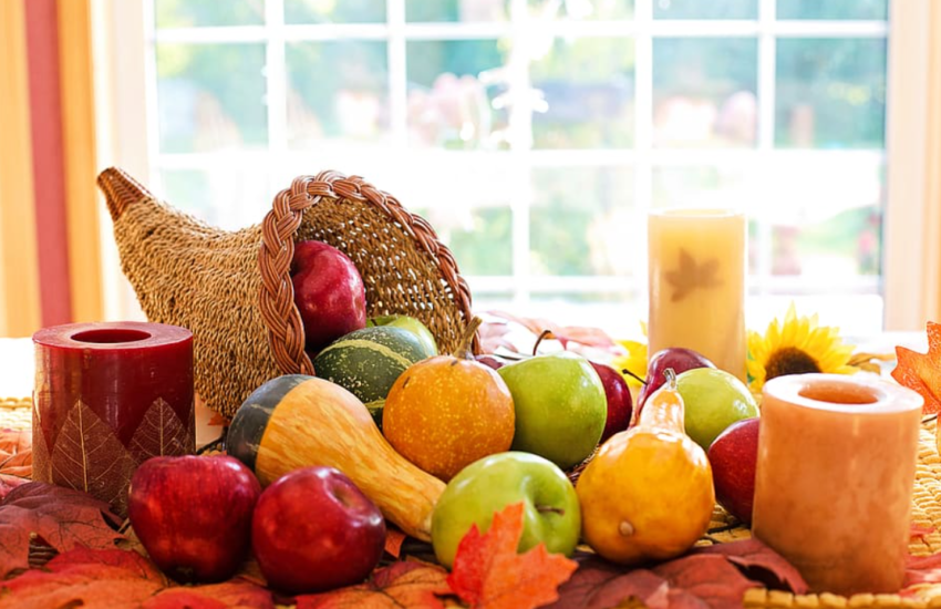 Thanksgiving cornucopia in front of a bright window
